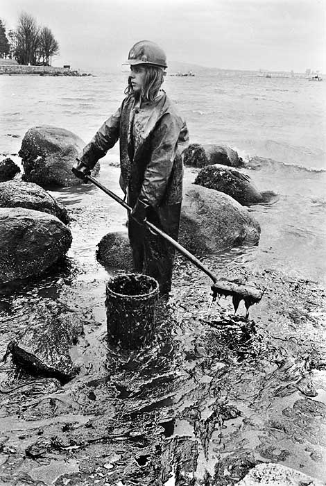 Volunteer cleaning oil spill in Stanley Park, 1973. Source: John Denniston (johndenniston.ca)